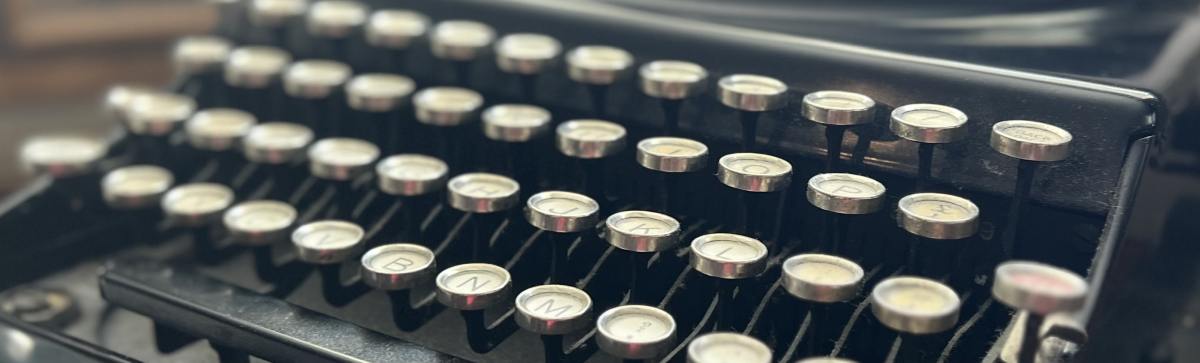 Close up photograph of a black vintage typewriter.
